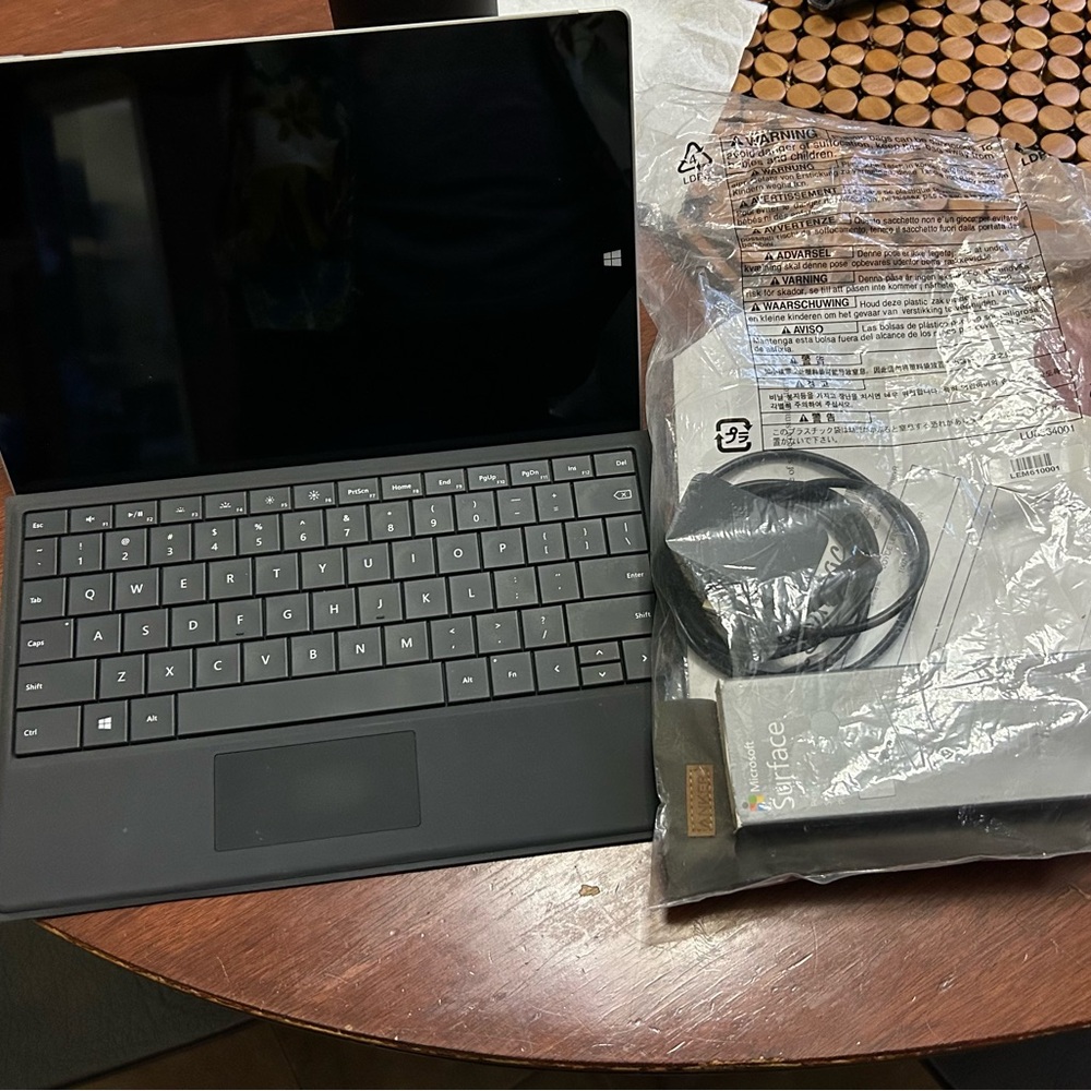 Microsoft Surface 3 with two pens with pink case